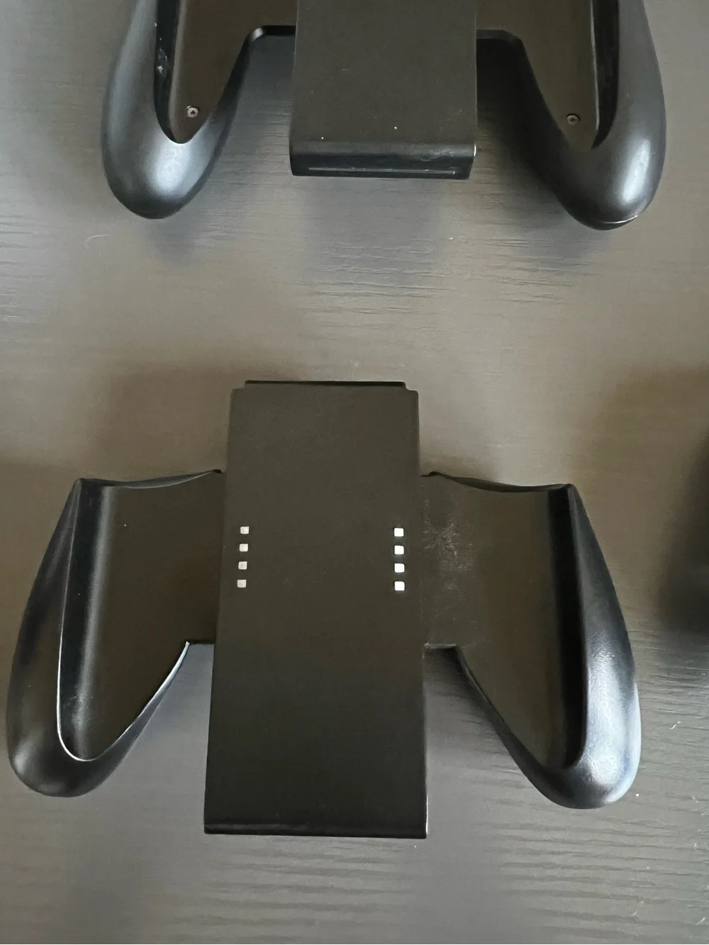 Nintendo Switch Joy-Con comfort grip and a black Joy-Con wrist strap. Used
